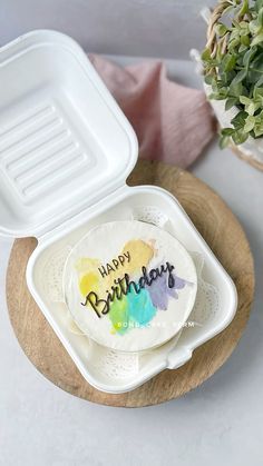 a happy birthday cake sitting on top of a plate