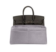 a gray bag with two compartments on the bottom and one in grey, sitting on top of