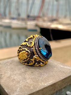 24 K Gold Plated Victorian Ring Ornate Ring Blue Topaz Gemstones Rococo Style Men Ring Handmade Ring Topaz Men  Ring PRODUCT DETAILS * Made to Order * Certified 925 sterling silver * Your ring comes in a pretty ring box ready for gift giving. RING SIZE *It is always safer to see a jeweler to have a more precise idea about your ring size. However, if it is not possible please look at our ring size chart in the pictures. There you can also find the size conversions. *If your ring size is not in th Elegant Topaz Rings With Stones, Topaz Anniversary Ring With Stones, Luxury Formal Rings With Stones, Handmade Luxury Crystal Ring For Formal Occasions, Handmade Luxury Topaz Ring For Anniversary, Luxury Handmade Topaz Ring For Anniversary, Handmade Luxury Topaz Anniversary Ring, Luxury Handmade Topaz Ring, Blue Topaz Rings With Stones