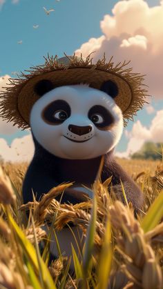 a panda bear with a straw hat sitting in the middle of some tall grass and looking at the camera