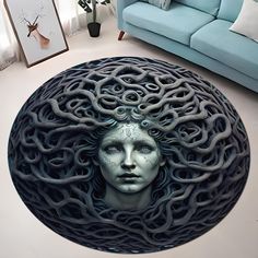 a woman's face is surrounded by an intricately designed circular rug in the middle of a living room