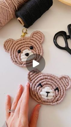 two teddy bears are being sewn together