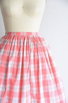 "Vintage 1950s handmade skirt. Slim one inch waistband. Pink & white plaid print. Side metal zip and hook-eye closure. Skirt has 100\" sweep. Extra panel near hem. State of garment | okay/good, a few small spots throughout the skirt and a few areas of tearing in back located on waistband (can be covered by belt). also additional fabric added to end of waistband closure (matches). refer to photos and request further photos if needed. Measurements ✂--- Best fit | Large Waist | 29\" Hips | free Tot Vintage Plaid Full Skirt, Vintage Plaid Summer Skirt, Retro Gingham Cotton Skirt, Vintage Plaid Cotton Skirt, Retro Plaid Cotton Skirt, Retro Full Skirt In Plaid, Retro Plaid Full Skirt, Retro Full Plaid Skirt, Pink Plaid Skirt