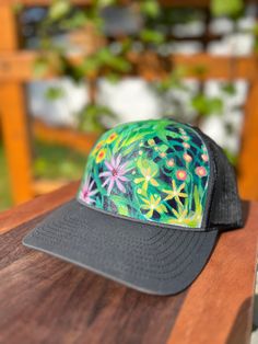 Looking for a way to stand out from the crowd? Check out Mary Bea Art's unique hand-painted hats! Each hat is a one-of-a-kind piece of wearable art, individually painted by Petoskey artist Mary Bea McWatters. With their bold colors and eye-catching designs, these hats are the perfect way to express your individual style and show off your love of nature and art. Whether you're looking for a way to add a pop of color to your outfit or just want a unique accessory that's sure to turn heads, Mary Be Artistic Hand Painted Adjustable Hats, Artistic Hand Painted Hat With Curved Brim, Artistic Hand Painted Flat Brim Hat, Artistic Adjustable Baseball Cap, Artsy Hand Painted Hat With Curved Brim, Artistic Hand-painted Cap, Artistic Hand Painted Cap, Hand Painted Snapback Hat, Hand Painted Adjustable Snapback Hat