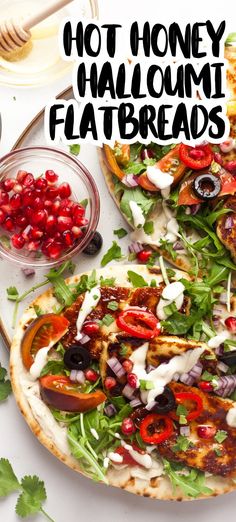 a flatbread pizza topped with lots of veggies next to a bowl of pomegranates