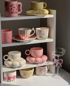 a shelf filled with cups and saucers on top of each other