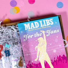 mad libs for the fans book sitting on a table with confetti around it