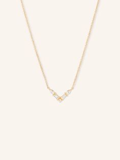 The Valence Diamond V Necklace showcases a striking, modern design with alternating diamond shapes set in a sleek 14k gold "V" formation. This unique arrangement of brilliant diamonds adds an extra touch of sophistication, making it perfect for both everyday wear and special occasions. With its clean lines and alternating diamond shapes, this necklace offers a contemporary twist on classic elegance. Diamond V Necklace, Gold Jewelry Dainty, V Necklace, Bracelet Box, Jewelry Dainty, Dream Ring, Pendant Bracelet, Brilliant Diamond, Chain Ring