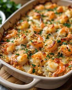 a casserole dish filled with shrimp and cheese