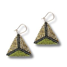 a pair of earrings with beaded triangles on the front and back of each ear