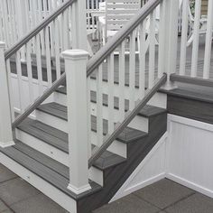 the stairs are painted white and have gray steps