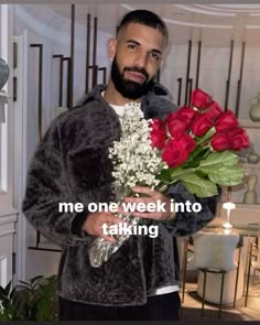 a man holding flowers in his hands with the caption me one week into taking