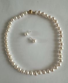 Elevate your jewelry collection with this stunning 2-piece set, featuring high-quality freshwater pearls and solid 14KT gold components. Perfect as a gift or an everyday staple, this set brings sophistication and durability in one beautiful package. Necklace Features: Pearl Type: Freshwater Pearl Size: 8.5-9mm Luster: High Length: 18 inches Clasp: Solid 14KT Corrugated Ball Clasp Thread: Hand-strung on 100% silk for durability and luxury. Earring Features: Pearl Type: Freshwater Pearl Size: 9.5-10mm Metal: Solid 14KT Yellow Gold Posts Earnut Options: Comes with silicone earnuts; upgrade available for solid 14KT earnuts. Luster: High Blemishes: Clean Why Choose This Set? Designed for versatility, making it suitable for casual outings or formal occasions. Each pearl is hand-selected, ensurin Luxury Earring, Pearl Necklace Earrings, Pearl Jewelry Sets, Freshwater Pearl Necklace, Pearl Types, Freshwater Pearl Necklaces, Wedding Jewellery, Wedding Jewelry Sets, Pearl Size