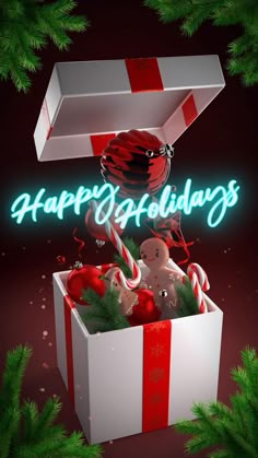 an open gift box with candy canes and candies in it that says happy holidays