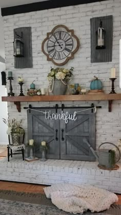 a fireplace with a sign that says happy thanksgiving above it and some flowers on the mantle