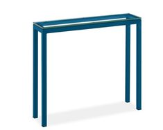 a blue table with a glass top and bottom shelf on the side, in front of a white background