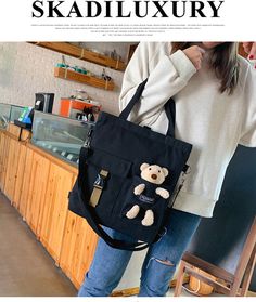 Brand Name: Cyflymder?Shape: Casual TotePlace Of Origin: ZHE JIANG ?ProvinceHandbags Type: TotesTypes of bags: Shoulder & HandbagsOrigin: CN(Origin)Main Material: CanvasClosure Type: zipperHardness: SOFTExterior: Silt PocketStyle: CasualLining Material: NoneOccasion: VersatileGender: WOMENPattern Type: SolidNumber of Handles/Straps: SingleInterior: Interior Slot PocketInterior: Cell Phone PocketInterior: Interior Zipper PocketInterior: Interior CompartmentInterior: Computer InterlayerDecoration: Harajuku Style Large Capacity School Bag, Harajuku School Bags With Pockets, Harajuku Style Backpack For Everyday, Cute Rectangular Canvas Bag With Adjustable Strap, Cute Bags For Daily Use And Back To School, Cute Rectangular Canvas Bag For School, Harajuku Style Large Capacity Everyday Bag, Everyday Harajuku Style Large Capacity Bag, Harajuku Style Rectangular Travel Bag