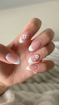 Nails With Lily Flower, White Almond French Tip Nails Design, Winter Flower Nail Designs, White Almond French Tip Nails With Design, Simple Flower Acrylic Nails, French Tips With Nail Art, Almond Nails Designs Flowers, Simple Nails With Flowers, Cute Nail Inspo Simple