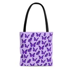 For nature-lovers on the go! This practical, high-quality Butterfly Tote Bag is the perfect vehicle for grocery shopping, carrying books, and storing anything your heart desires. This also makes a great gift for that butterfly-lover in your life. Available in three sizes and three colors, its all over print fuses comfort with style. This Tote Bag is made from reliable materials that will allow it to last for seasons. The extremely strong and durable polyester body retains its shape and dries qui Butterfly Tote Bag, Purple Tote Bag, Stylish School Bags, Mattel Shop, Nature Inspired Design, Purple Butterfly, Hearts Desire, The Butterfly, Grocery Shopping