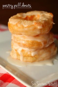 three glazed donuts stacked on top of each other