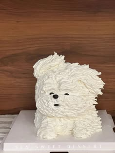 a cake shaped like a dog sitting on top of a table