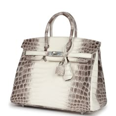 This Himalaya Birkin is in Niloticus crocodile leather with palladium hardware and has contrast stitching, front flap, two straps with center toggle closure, clochette with lock and two keys, and double rolled handles.The interior is lined with Gris Tourterelle chevre leather and has one zip pocket with an Hermes engraved zipper pull and an open pocket on the opposite side. Payment for this item is by Bank Wire only unless other arrangements have been made.Collection: YOrigin: FranceCondition: N Birkin Crocodile, White Crocodile, Rich Aunt, Birkin 30, Fancy Things, Hermes Birkin 25, Hermes Birkin 30, Hermes Box, Madison Avenue