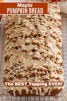 a loaf of maple pumpkin bread on a cooling rack with the words maple pumpkin bread above it