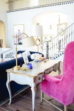 a living room filled with furniture and color swatches in shades of pink, blue, yellow