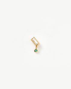 Fine Emerald Single Drop Stud Earring 14ct Solid Gold/Emerald. This Single Drop Earring is an Elevated Take on Our Signature Studs, Featuring a Baguette-Shaped White Topaz Stone with a Drop Round Emerald Charm. Mix and Match with Other Refined Designs. Handcrafted from 100% Certified Recycled Solid Gold, and Hallmarked for Authenticity. Metal: 14Ct Recycled Yellow Gold Dimensions: 4mm X 7. 6mm Gemstone: Emerald Weight: 0. 5g Product Code: Fj-G-E31-Wt-Em-Hf Bee Purse, Emerald Style, Earring Trends, Mini Hoop Earrings, Hoop Earring Sets, Demi Fine Jewelry, Emerald Earrings, Solid Gold Jewelry, Topaz Stone