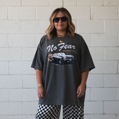 This WOMEN'S oversized tee will be your new weekly staple. Trust us :) - 100% COTTON - Washed grey/light black color tee - Off white and black design with a pop of orange - Super slouchy, and comfy -VERY oversized fit so please review size chart below -S/M is equivalent to unisex XL -L/XL is equivalent to unisex 3XL -Model 1 is wearing the L/XL and Model 2 is wearing the S/M. -Graphic by Ash Ulmer of Ash Ulmer Design. CARE INSTRUCTIONS: Wash inside out in cold water, gentle cycle + air dry. WILL SHRINK IN DRYER! Design by Lauren Borits. Gray Oversized Slogan T-shirt, Oversized Gray T-shirt With Text Print, Oversized Gray Slogan Tops, Oversized Gray Tops With Slogan, Oversized Gray Top With Graphic Print, Oversized Gray T-shirt With Screen Print, Gray Graphic Print T-shirt For Everyday, Trendy Oversized Gray T-shirt, Oversized Gray Grunge T-shirt