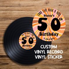 an old vinyl record with the number 50 on it and some birthday stickers for someone's 50th birthday