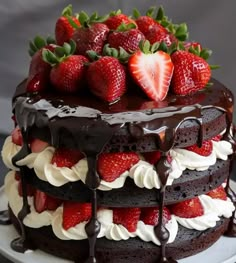 a chocolate cake with strawberries on top