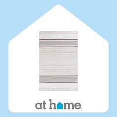 the home logo is shown in front of a house with a striped rug on it