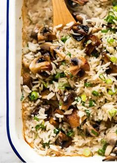 a casserole dish filled with rice and mushrooms