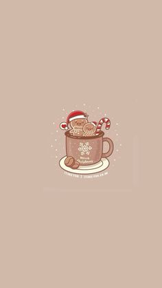 a cup filled with hot chocolate on top of a saucer and candy canes