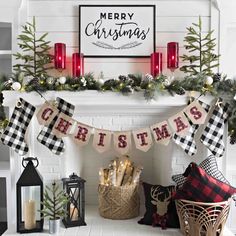 a fireplace decorated for christmas with stockings and candles