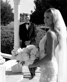 a man in a tuxedo standing next to a bride