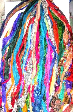 a pile of multicolored ribbons hanging from the ceiling