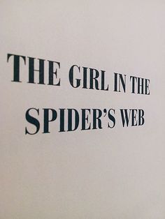 the girl in the spider's web logo is black on white paper with words underneath it