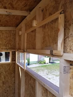 the inside of a house being built with plywood boards and wood panels on the walls