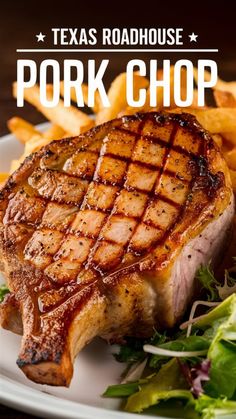 pork chop on a plate with french fries and lettuce in the foreground