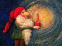 an image of a needle - felted gnome holding a candle in his hand and spinning it around