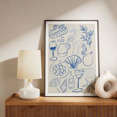 a blue and white art piece sitting on top of a wooden shelf next to a lamp