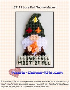 a cross stitch pattern for a christmas ornament with a gnome holding a bird