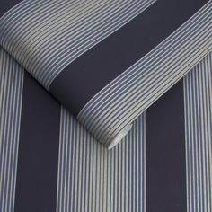 a blue and white striped wallpaper with vertical stripes on it's surface,