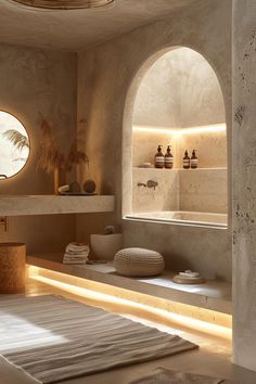 a bathroom with stone walls and arched windows is lit up by the light coming through the round window