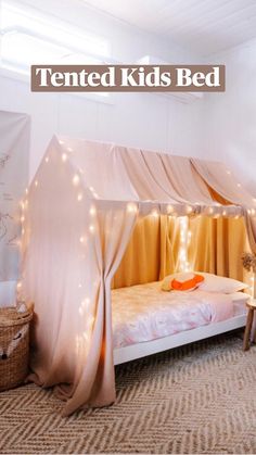 a canopy bed with lights on it in a room