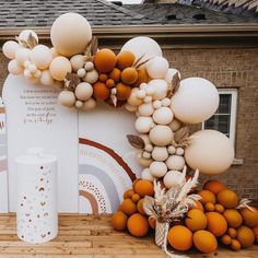 an outdoor display with balloons and decorations