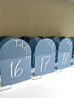 the table numbers are blue with white numbers on them, and they appear to be numbered