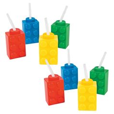 four lego toothbrushes are lined up in the shape of cubes with different colors